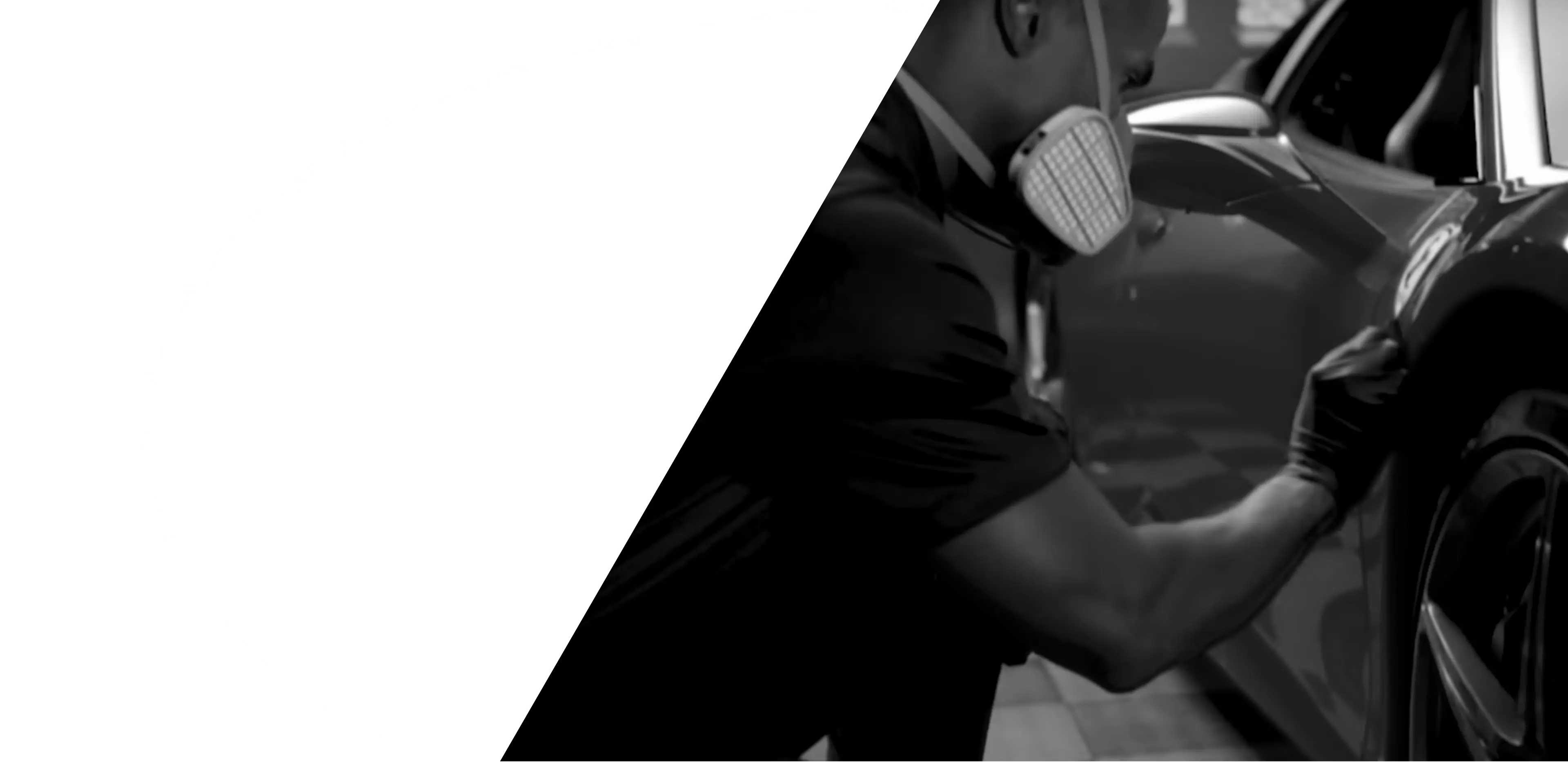Person cleaning a car wheel with a brush