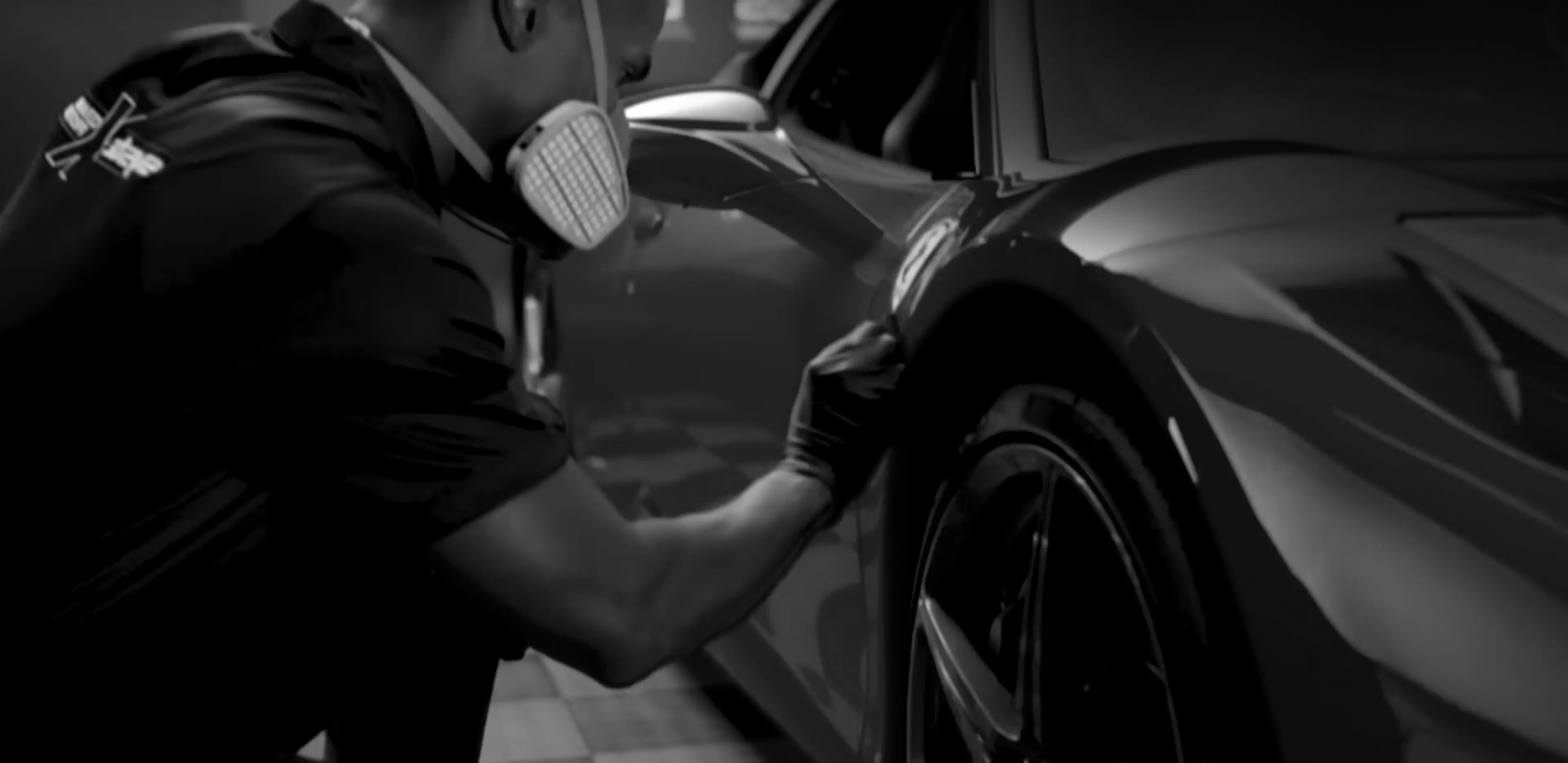 Person applying a protective coating to a car's surface